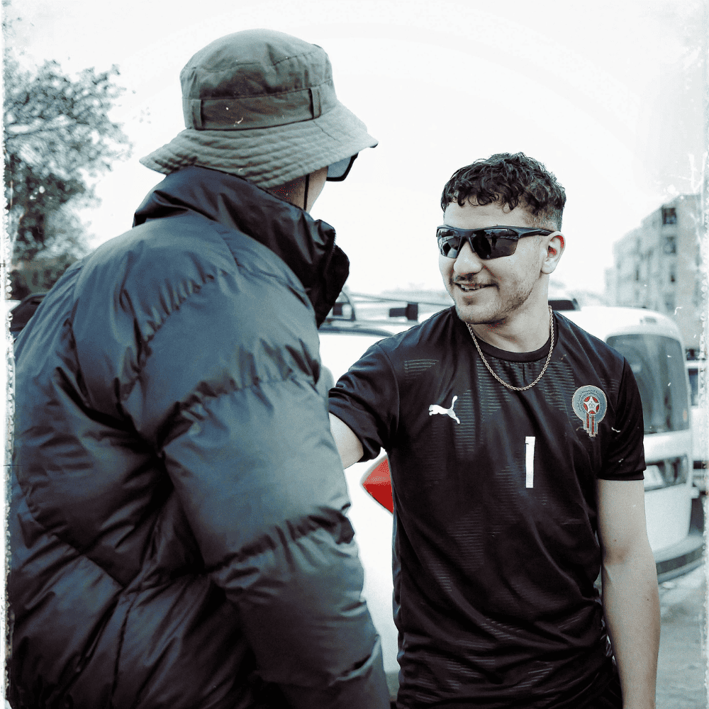 a man wearing Morocco's football goalkeeper bono's shirt