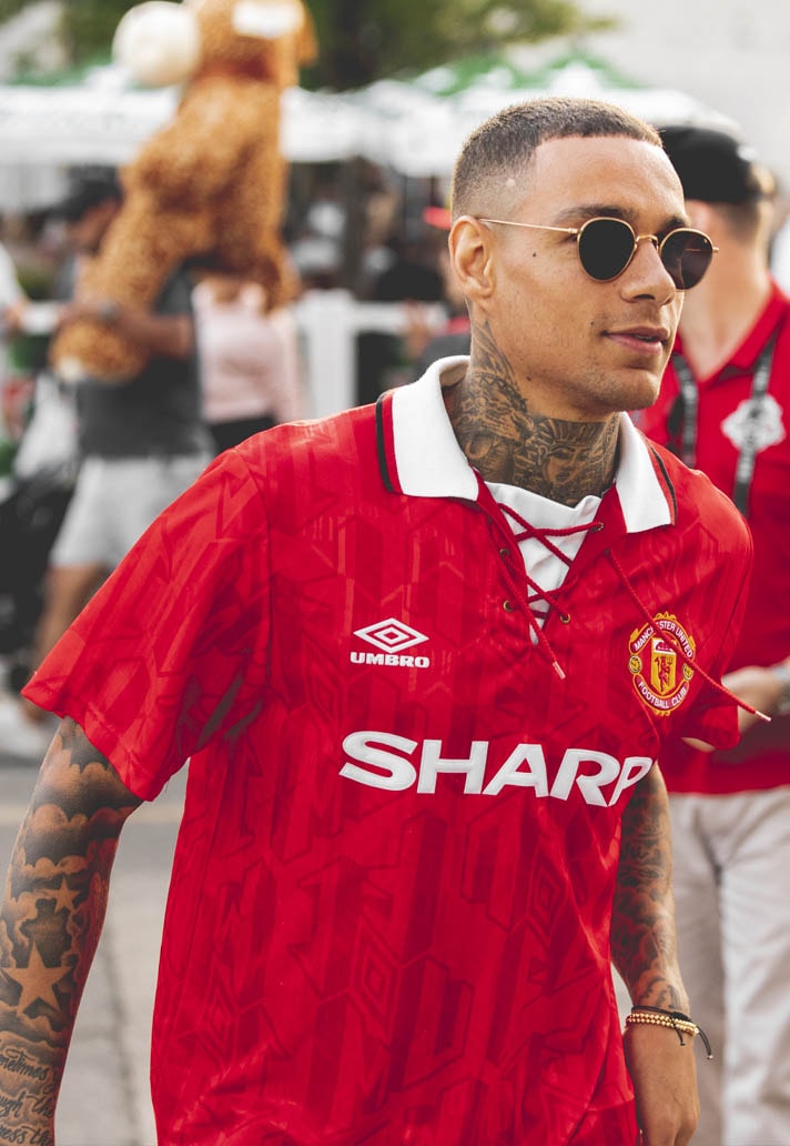 Gregory Van Der Wiel wearing cantonas retro manchester united jersey