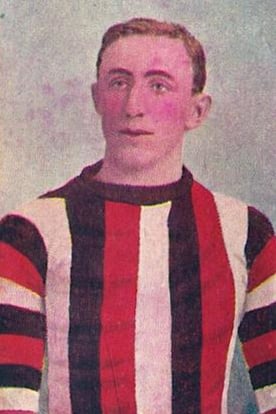 an old football player wearing an old football kit