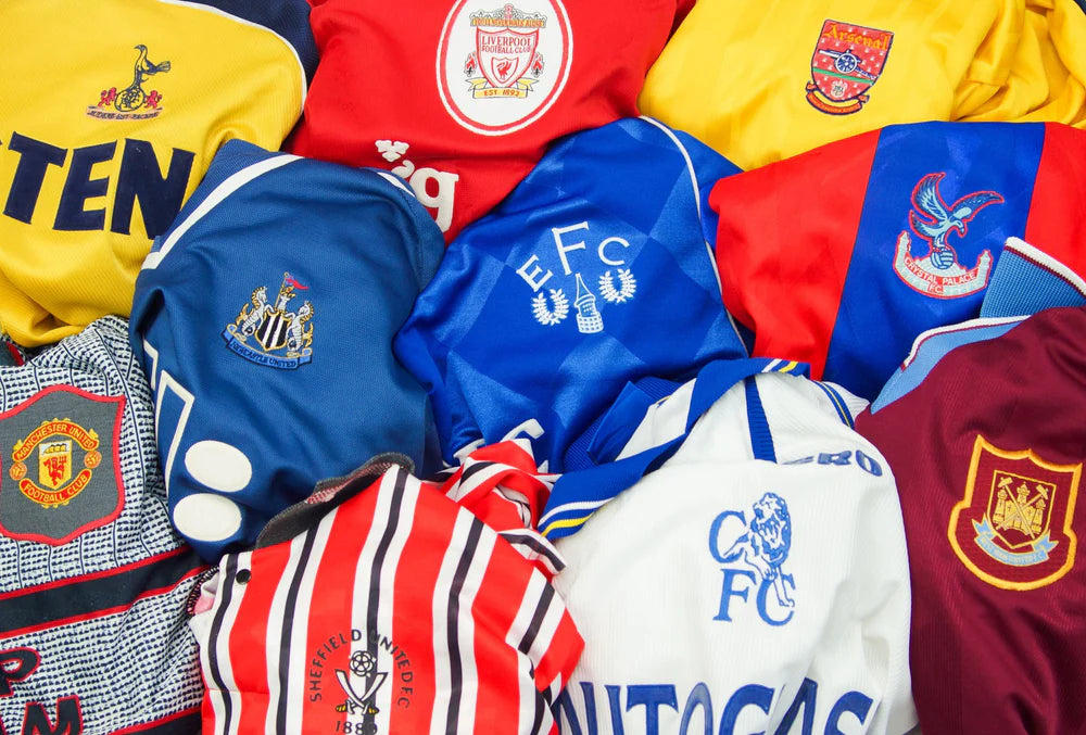 a pile of Premier League retro football shirts - vintage football shirts - retro soccer jerseys - vintage soccer jerseys