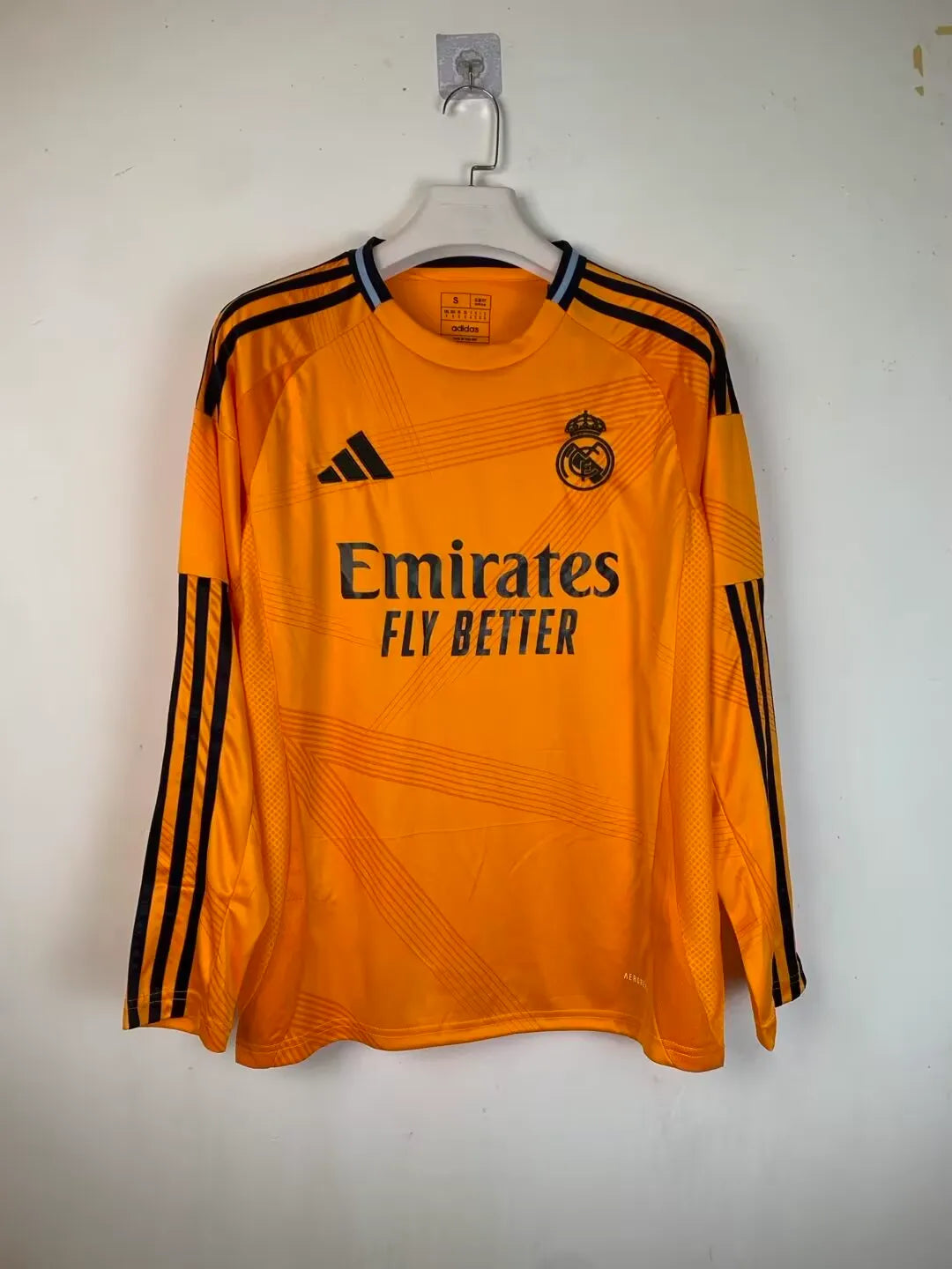 real-madrid-shirt-2024-25-orange-long-sleeves