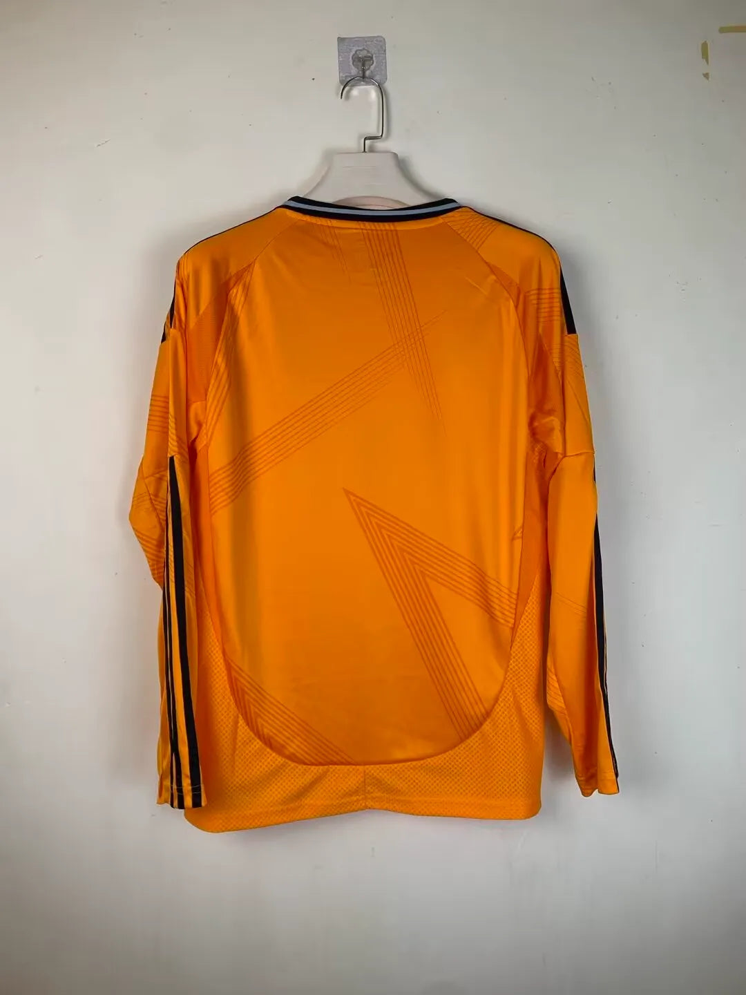 real-madrid-shirt-2024-25-orange-long-sleeves